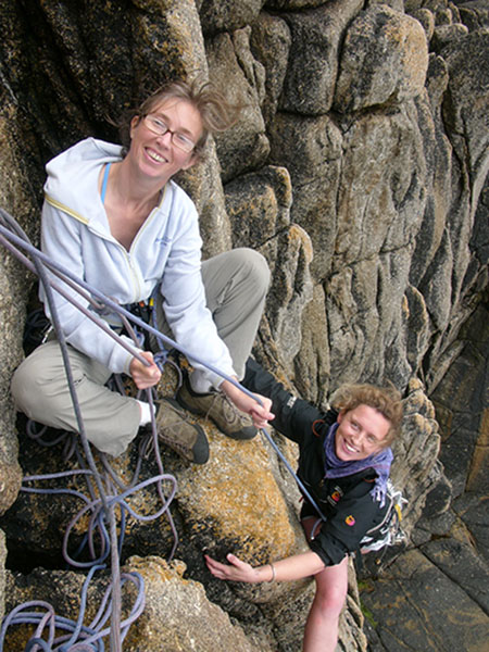 two women climbing in the peak district with wilderness weekends